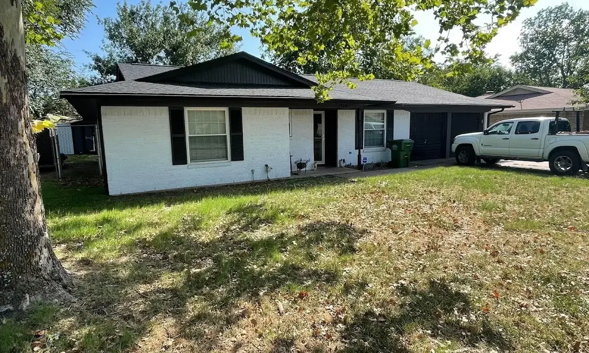 Professional roofing crew working on a residential roof in Endicott